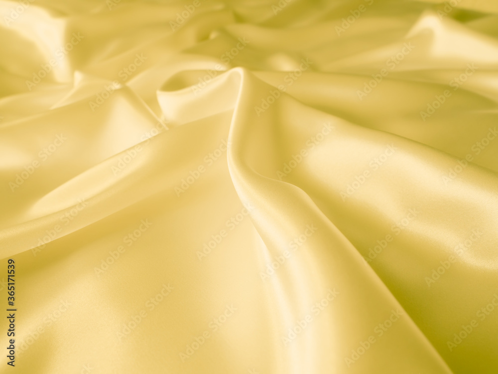 Beautiful smooth elegant wavy light yellow satin silk luxury cloth fabric texture, abstract background design. Copy space. Wedding, engagement concept. Beautiful smooth elegant wavy light yellow satin silk luxury cloth fabric texture, abstract background design. Copy space. Wedding, engagement concept.