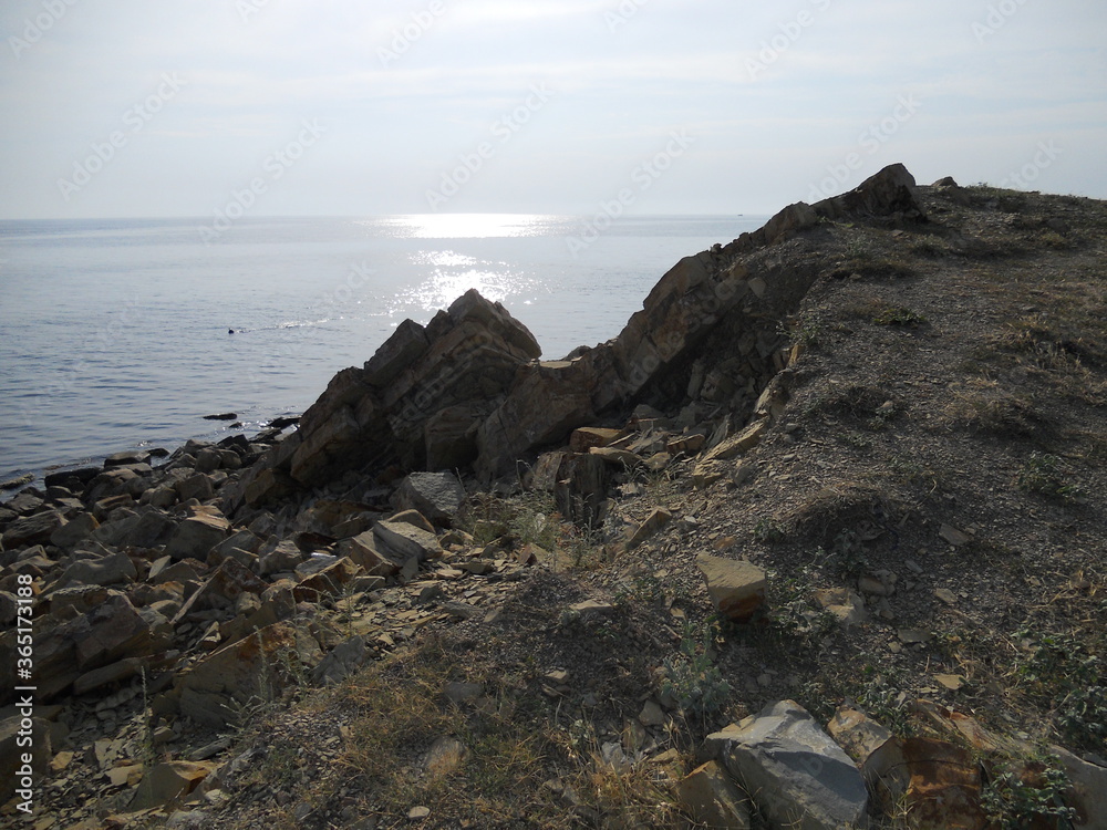 Sea, sun, pebbles, rocks and sand. Rest and tan. Endless shapes and shades. Sea, sun, pebbles, rocks and sand. Rest and tan. Endless shapes and shades.