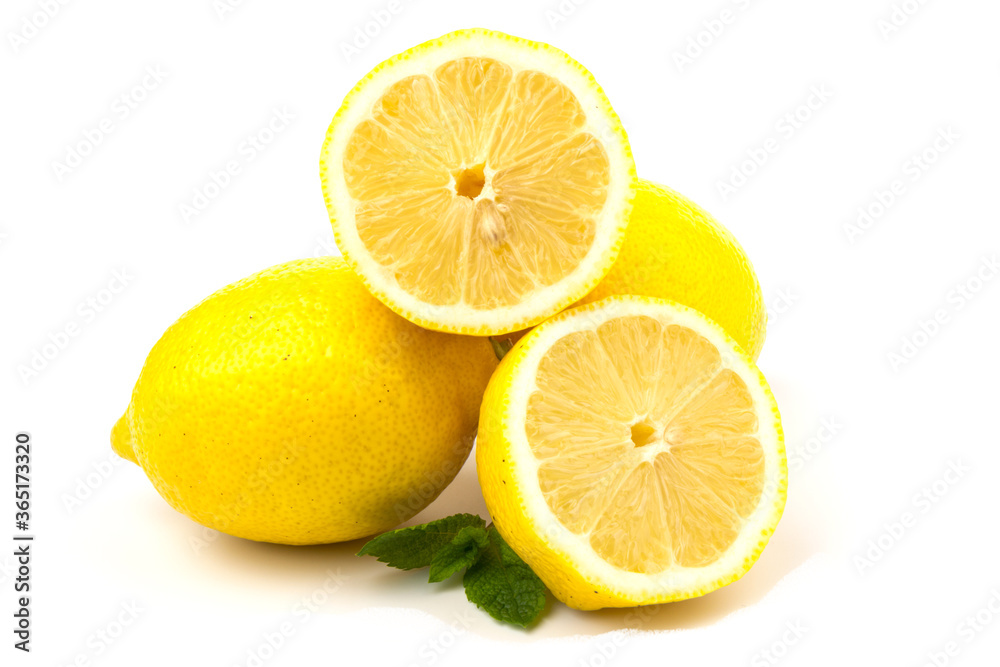 Group of lemons with mint leaves, isolated on white background