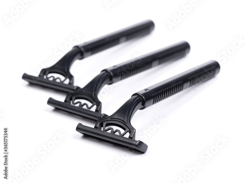 Group of new black plastic disposable shavers