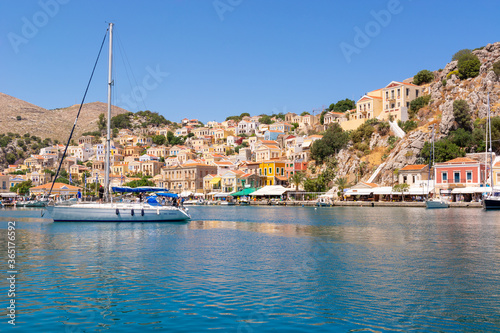 The beautiful island of Symi with a turquoise bay and colorful architecture Dodecanese, Greece