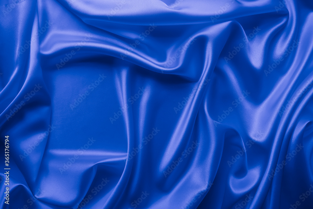 Obraz premium Beautiful elegant wavy classic blue satin silk luxury cloth fabric texture, abstract background design.