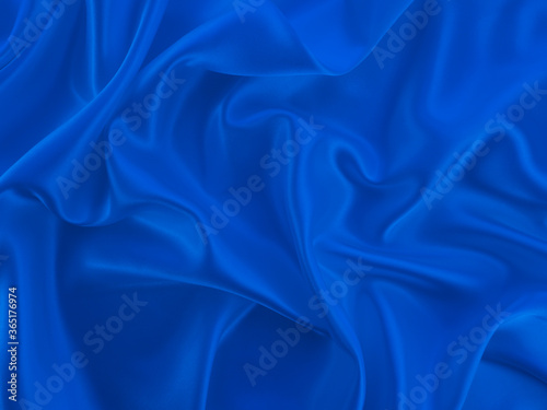 Beautiful elegant wavy classic blue satin silk luxury cloth fabric texture, abstract background design.