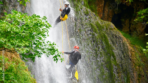 Descenso por cascadas de agua con cuerdas. Barranquismo photo