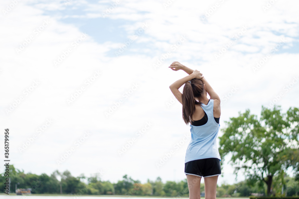 Asian women runner stretch before exercise.