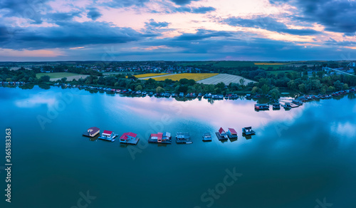 Lake Bokod next to Oroszlany city in Hungary. This is a man-made cooling lake for the power plant what there is shore. Here is the famous fishing floating village too. photo