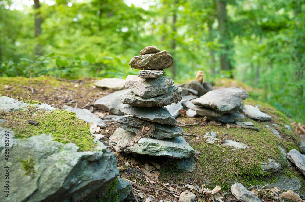 stone man stone pile in the forest on a hiking trail in germany as a new leisure pleasure