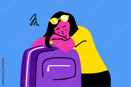 Sleep, tourism, travelling, depression, mental stress, frustration, fatigue concept. Young sad depressed frustrated woman girl traveler tourist lying on bag suitcase. End of summer vacation or holiday