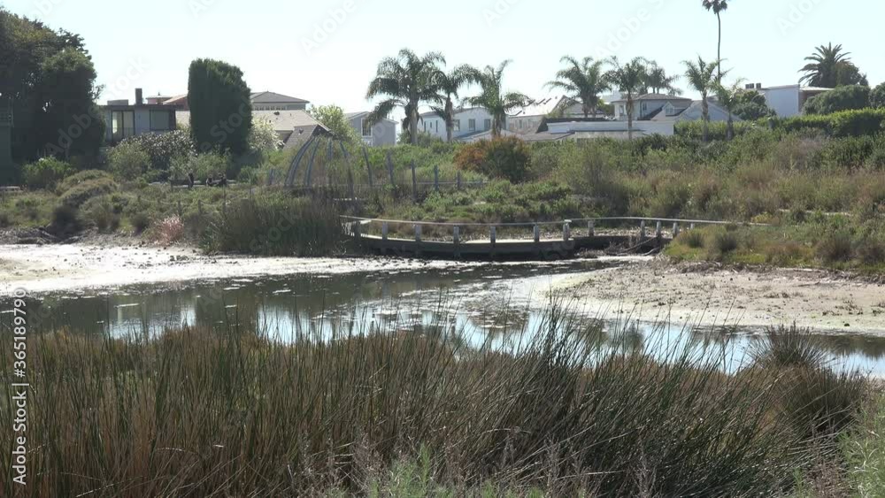 Footbridge over the water in the peaceful Malibu Lagoon Footbridge over the water in the peaceful Malibu Lagoon