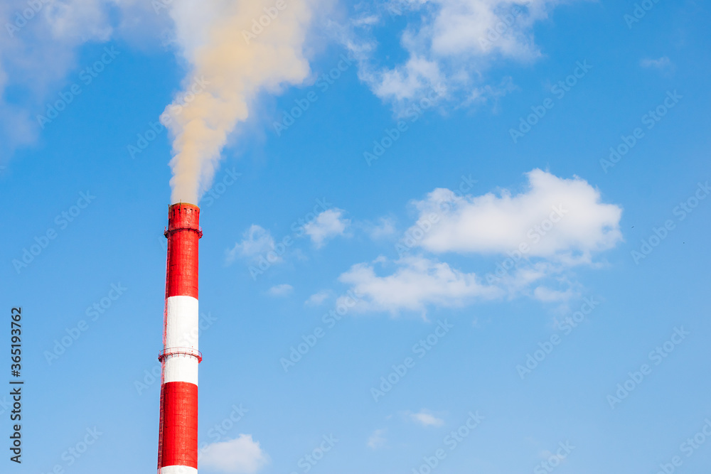 Industrial chimneys smoke smog on blue sky. Air pollution disaster concept. Day of the Planet Earth. Horizontal frame