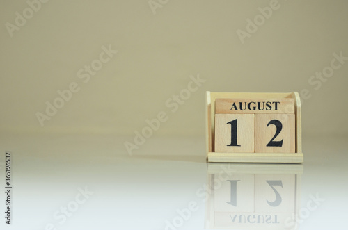 August 12, Number cube with the reflection on the ground. photo