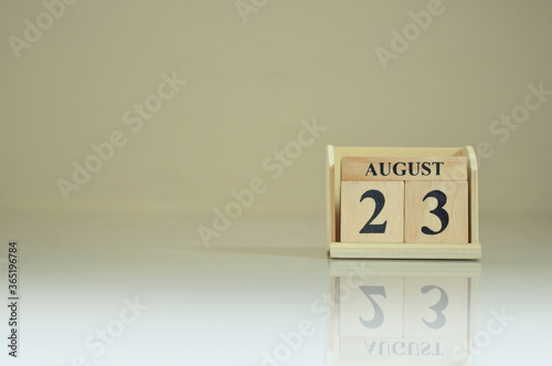 August 23, Number cube with the reflection on the ground. photo