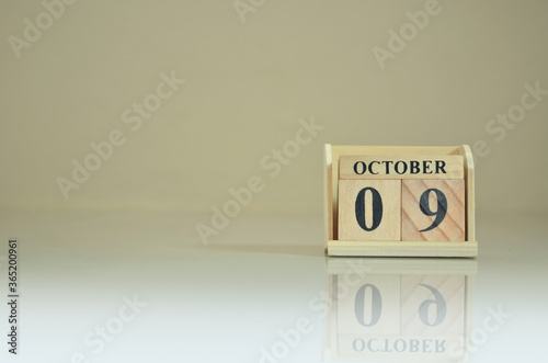 October 9, Number cube with the reflection on the ground. photo