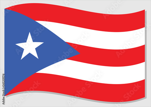Waving flag of Puerto Rico vector graphic. Waving Puerto Rican flag illustration. Puerto Rico country flag wavin in the wind is a symbol of freedom and independence.