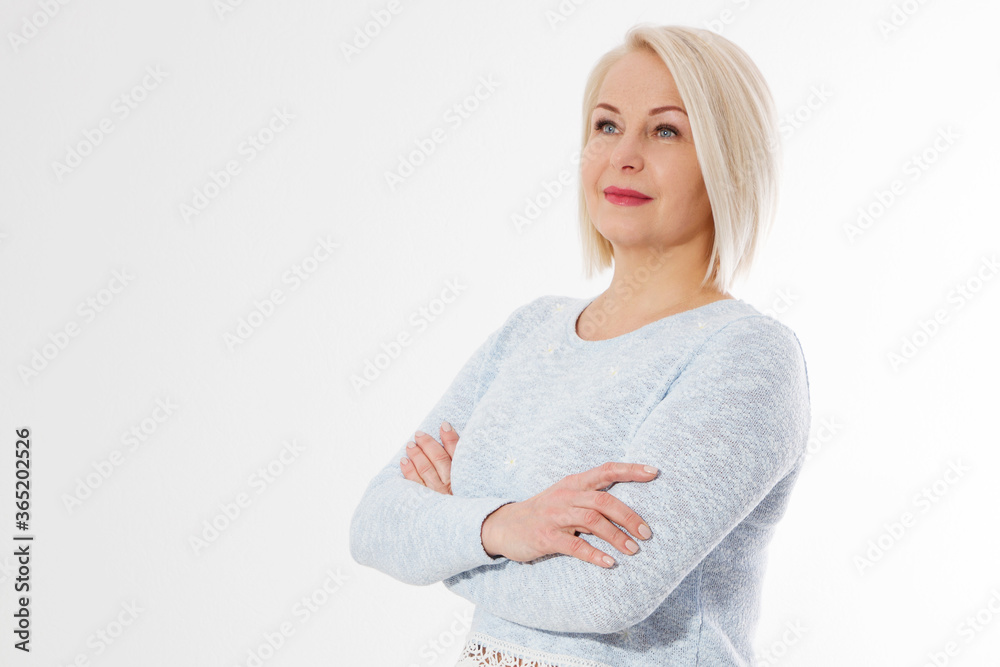 Happy beautiful close up portrait middle age blonde woman. Mid aged healthy female isolated on white background with copy space. Menopause and healthcare. Mature lady wrinkled face. Folded hands Happy beautiful close up portrait middle age blonde woman. Mid aged healthy female isolated on white background with copy space. Menopause and healthcare. Mature lady wrinkled face. Folded hands