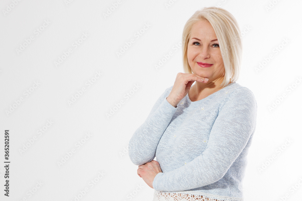 Happy beautiful close up portrait middle age blonde woman. Mid aged healthy female isolated on white background with copy space. Menopause and healthcare. Mature lady wrinkled face. Folded hands Happy beautiful close up portrait middle age blonde woman. Mid aged healthy female isolated on white background with copy space. Menopause and healthcare. Mature lady wrinkled face. Folded hands
