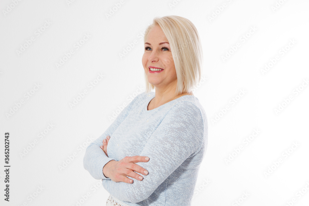 Happy beautiful close up portrait middle age blonde woman. Mid aged healthy female isolated on white background with copy space. Menopause and healthcare. Mature lady wrinkled face. Folded hands Happy beautiful close up portrait middle age blonde woman. Mid aged healthy female isolated on white background with copy space. Menopause and healthcare. Mature lady wrinkled face. Folded hands