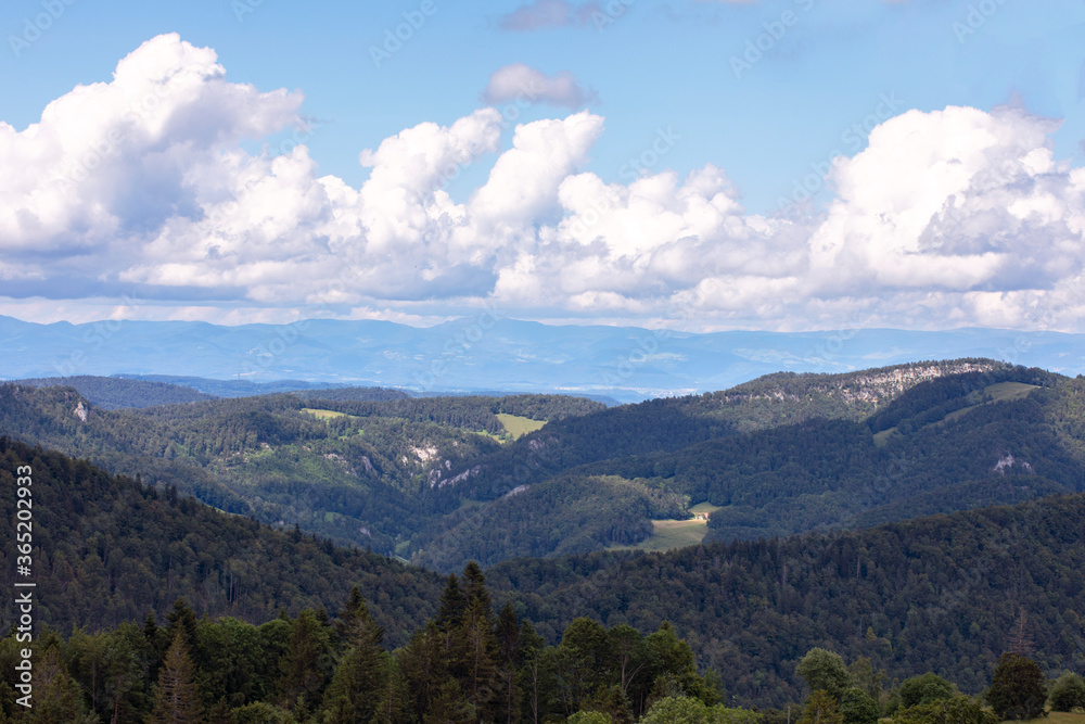 Hills of Jura mountains, swiss idyll landscape, summer day. Naturpark Thal, Switzerland.
