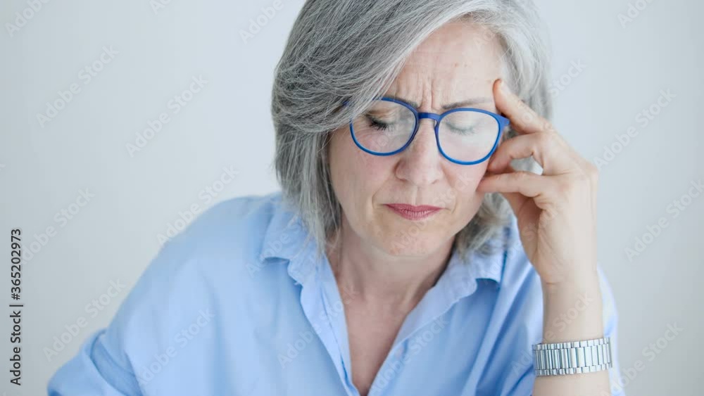 Tired business woman feeling headache during work, overtime work, retirement