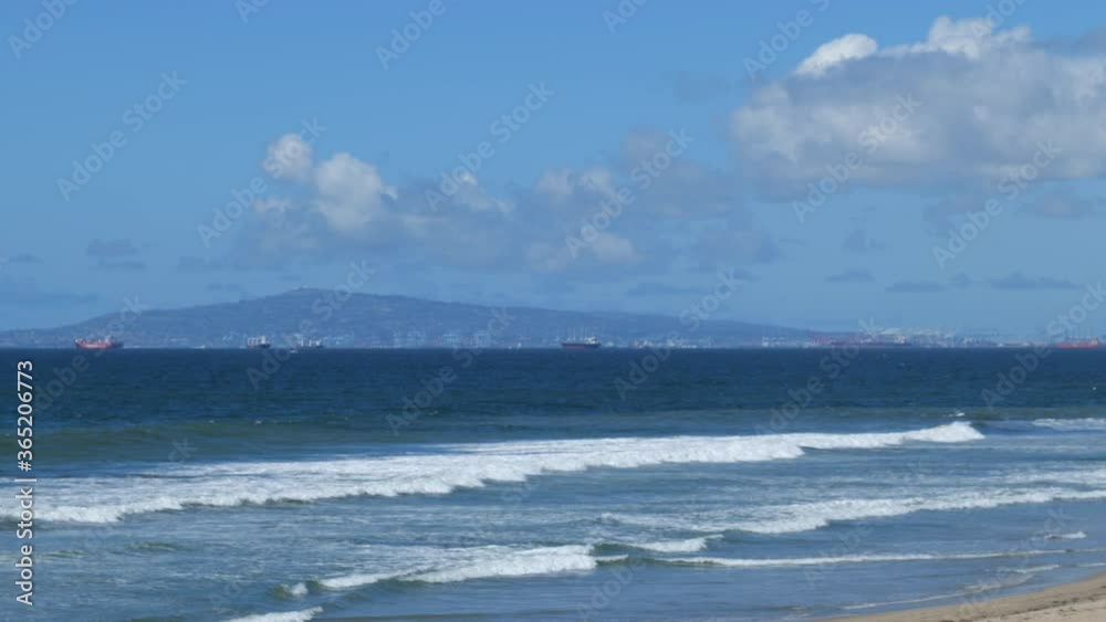 Long Beach Skyline seen from across the waves breaking in the Pacific Ocean Long Beach Skyline seen from across the waves breaking in the Pacific Ocean