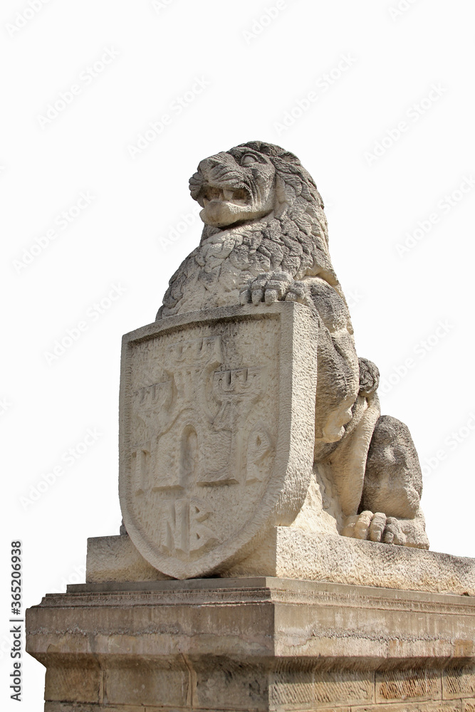 isolated sculpture of a lion with a shield sitting on a pedestal 