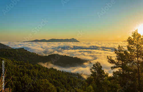 Sunrise views from the Montcabrer mountain in a day with clouds, Cocentaina.