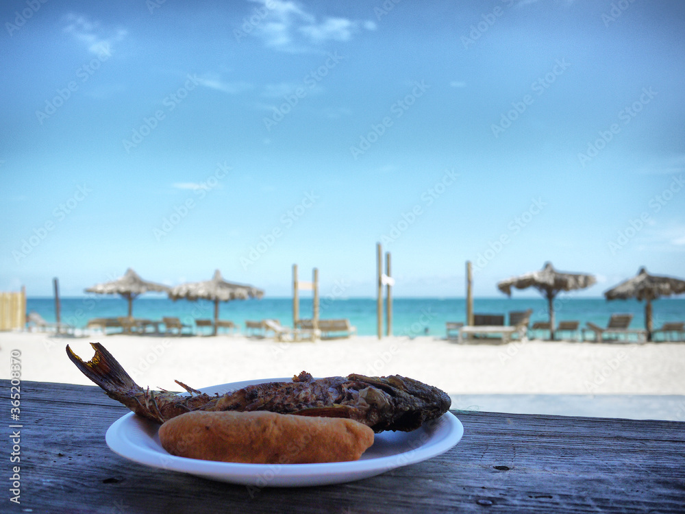 Jamaican Food A Plate of Fried Fish and Festival on Hellshire Beach in