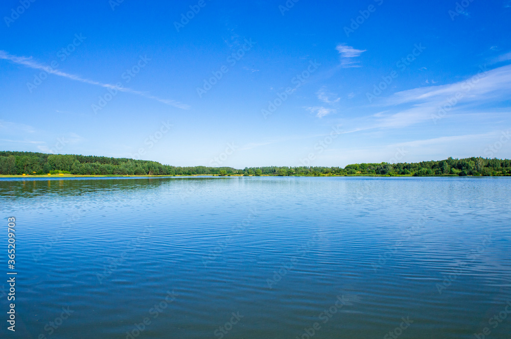 Blue lake with sky reflection in the water