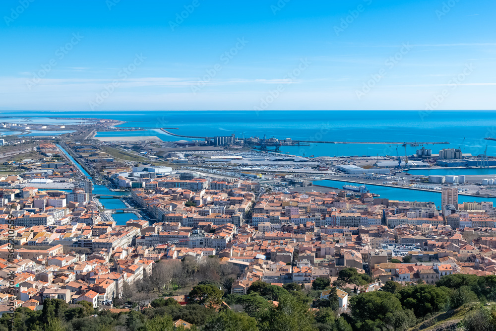 Sète in France, aerial panorama, the harbor and the city with typical tiles roofs
