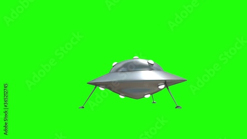 UFO is landing in the Studio on a chroma key. 3D render and mask for isolated video. 