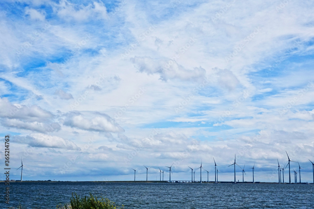 Netherlands. Zeeland. Windmills and blue sky