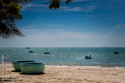 Vietnam corracles on the Mui Ne beach photo