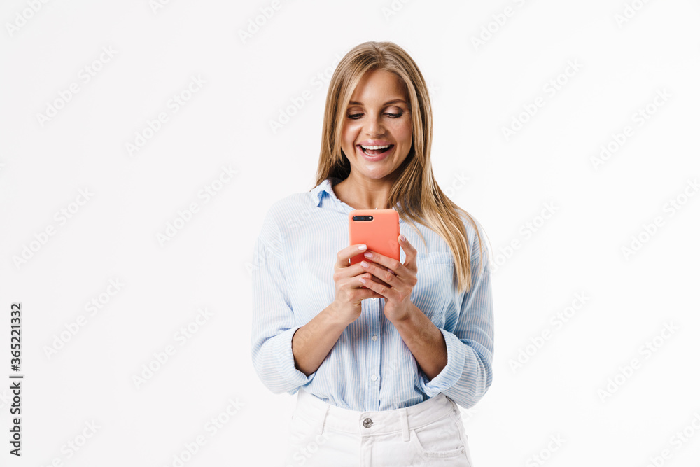Image of happy blonde woman using mobile phone and smiling Image of happy blonde woman using mobile phone and smiling