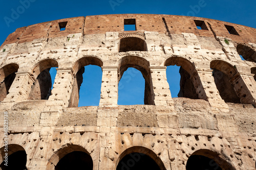 Architectural details of the facade of the Colosseum (Coliseum) or Flavian Amphitheatre, the largest Roman amphitheater located in city of Rome, Italy