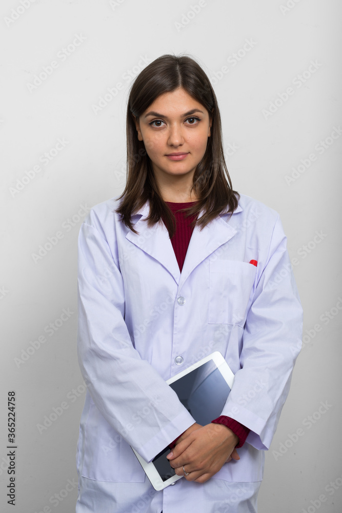 Portrait of young beautiful woman doctor with brown hair Portrait of young beautiful woman doctor with brown hair