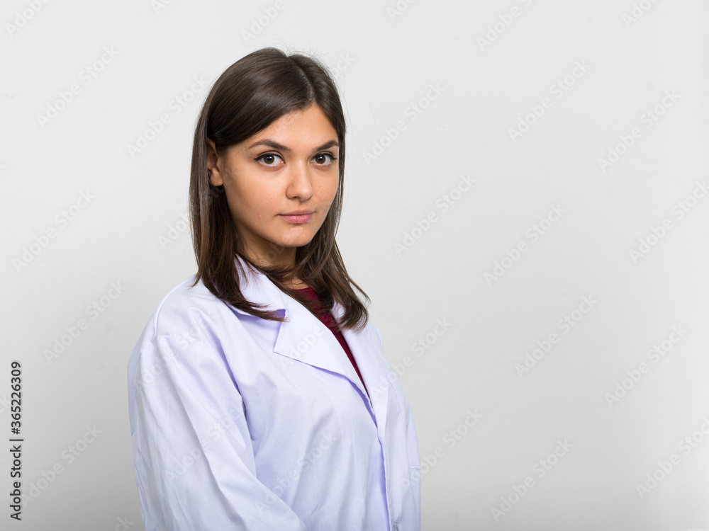 Portrait of young beautiful woman doctor with brown hair Portrait of young beautiful woman doctor with brown hair