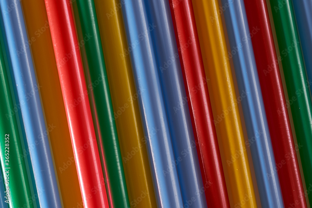 Abstract Background Multicolored Plastic Drinks Tubes. Close-up. Abstract Background Multicolored Plastic Drinks Tubes. Close-up.