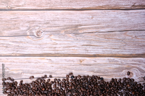 coffee cup and coffee beans on old wood table background  space for text