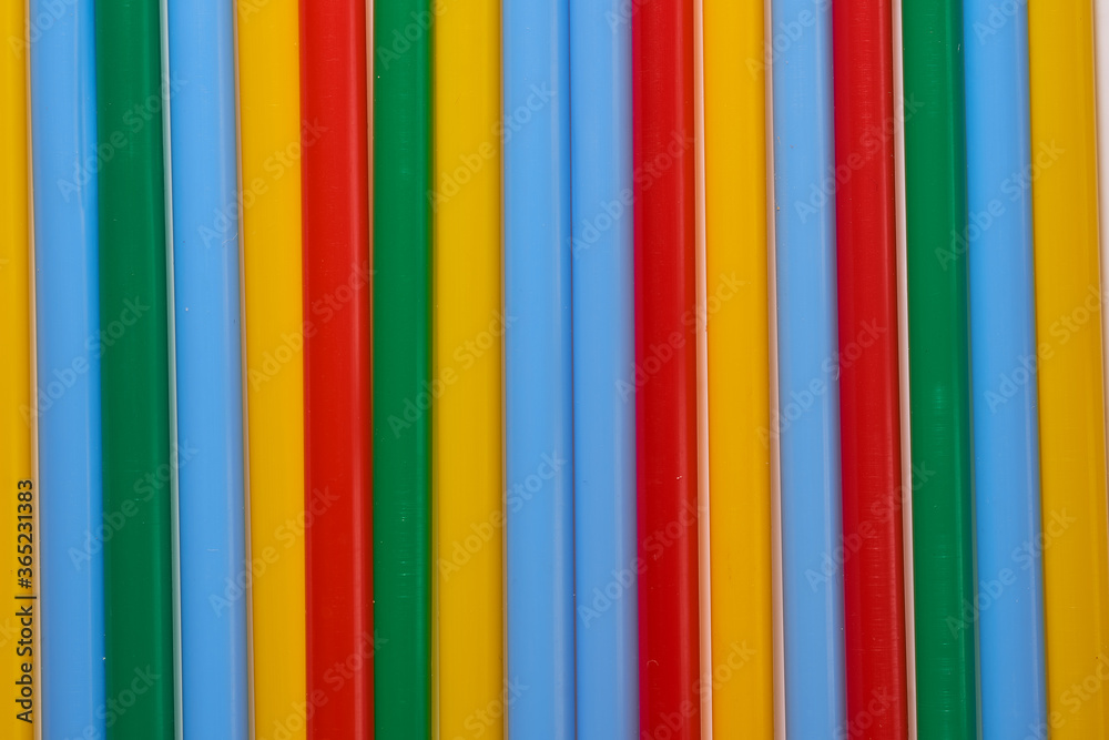 Abstract Background Multicolored Plastic Drinks Tubes. Close-up. Abstract Background Multicolored Plastic Drinks Tubes. Close-up.