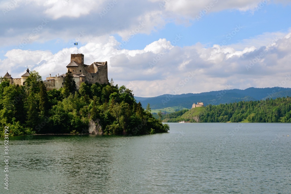 Lake Czorsztyn and medieval castle in Niedzica. The beauty of nature and architecture in Southern Poland. On the other side of the Czorsztyn Lake is located Czorsztyn Castle. 