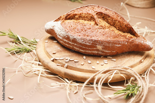 Wallpaper Mural Fresh homemade bread with seeds and rosemary on wooden cutting board with copy space Torontodigital.ca