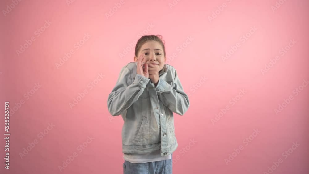The girl stands and then gets scared and put her hands forward to protect her. The girl stands and then gets scared and put her hands forward to protect her.
