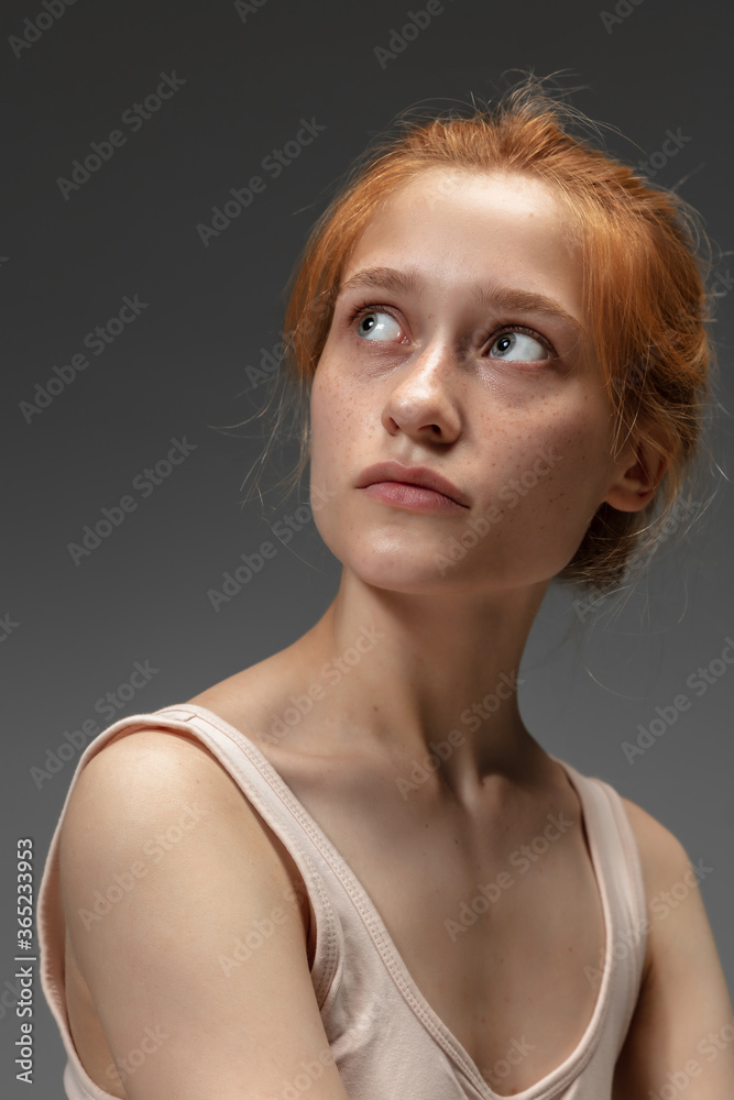 Dreams. Fashion portrait of beautiful redhead woman isolated on grey studio background. Concept of beauty, skin care, fashion and style. Artwork, modern and trendy portrait. Attractive model. Dreams. Fashion portrait of beautiful redhead woman isolated on grey studio background. Concept of beauty, skin care, fashion and style. Artwork, modern and trendy portrait. Attractive model.