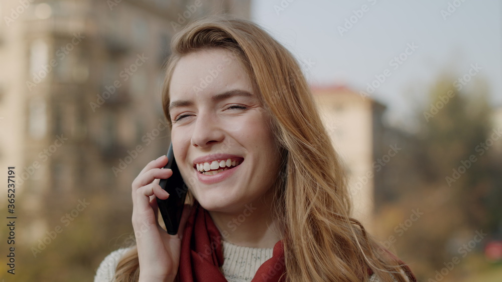 Happy woman calling mobile phone outdoors. Smiling girl talking cellphone. Happy woman calling mobile phone outdoors. Smiling girl talking cellphone.