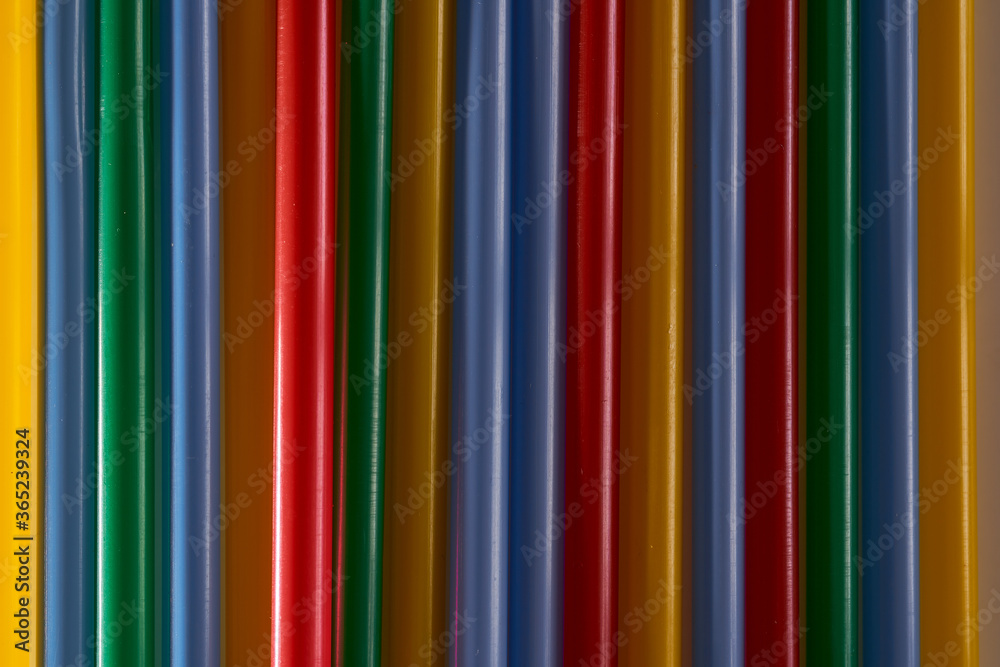 Abstract Background Multicolored Plastic Drinks Tubes. Close-up. Abstract Background Multicolored Plastic Drinks Tubes. Close-up.