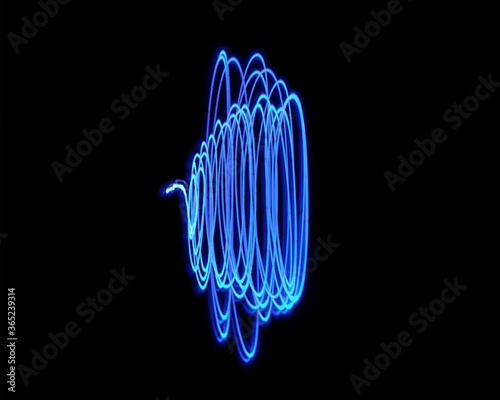 Light painting design. Combination of sky blue and white light against a black background 