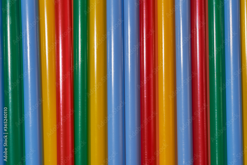 Abstract Background Multicolored Plastic Drinks Tubes. Close-up. Abstract Background Multicolored Plastic Drinks Tubes. Close-up.