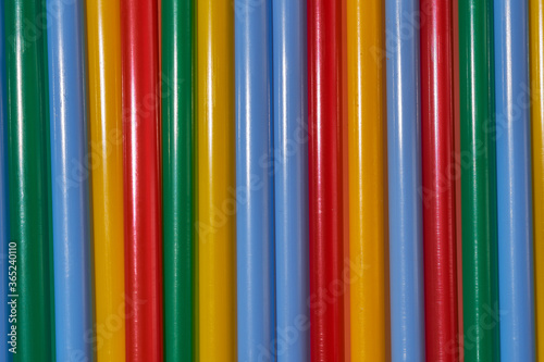 Abstract Background Multicolored Plastic Drinks Tubes. Close-up.