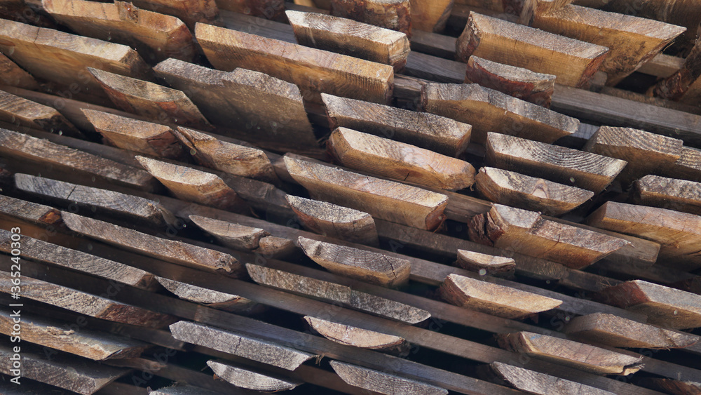 Stacked pine timber, sawn raw boards as background