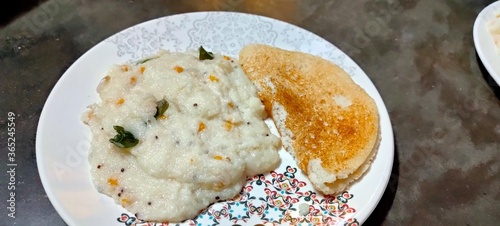 Indian famous breakfast, upma and uttappam served in plate
